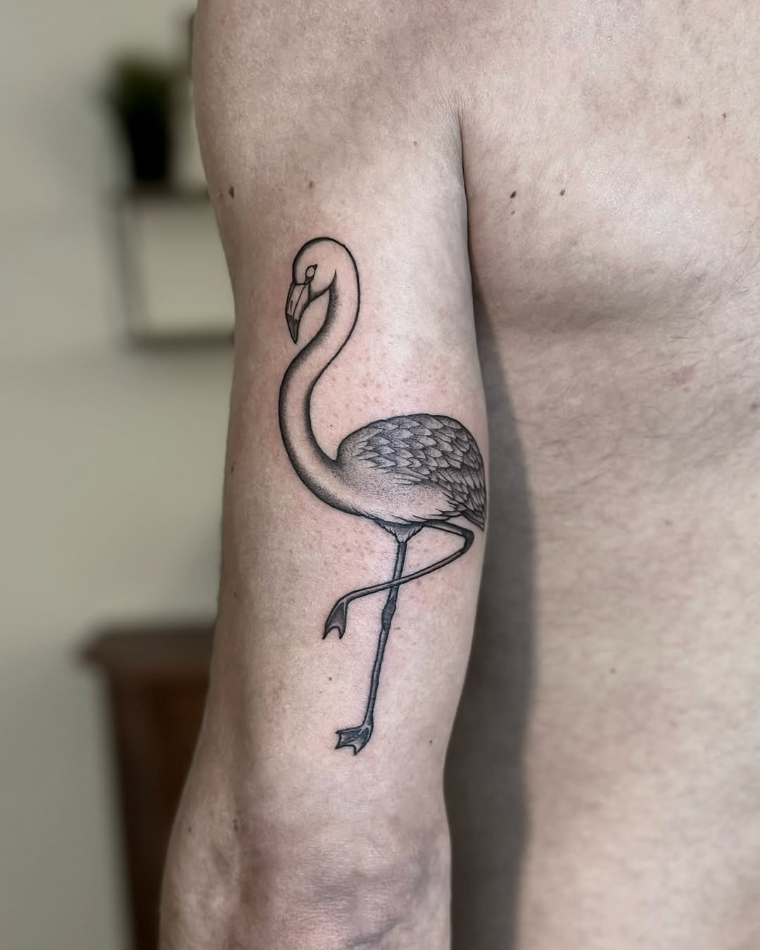 Stylish flamingo tattoo on muscular arm Tattoo Design