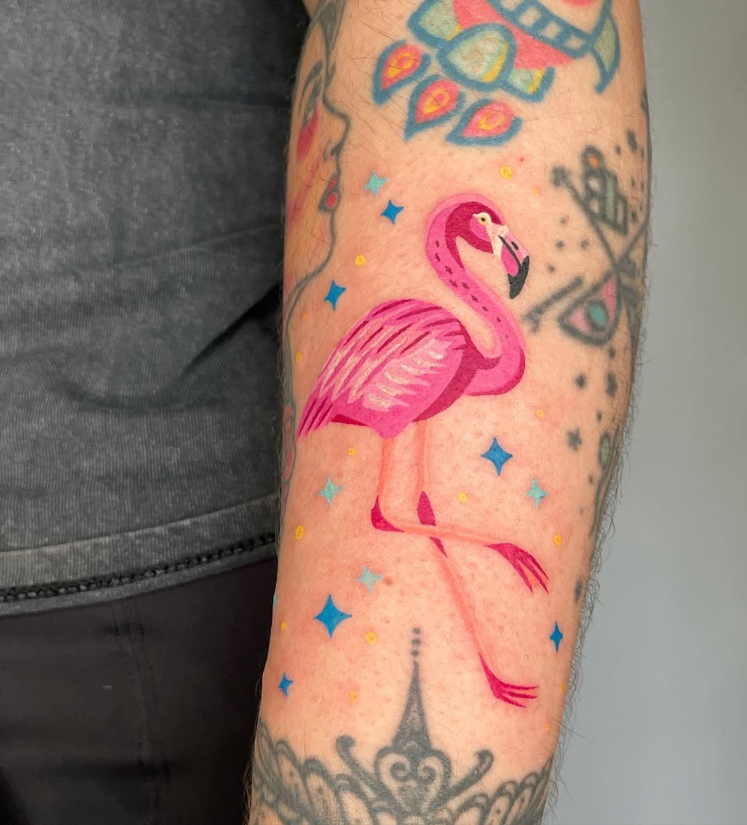 Vibrant flamingo tattoo with playful star accents Tattoo Design