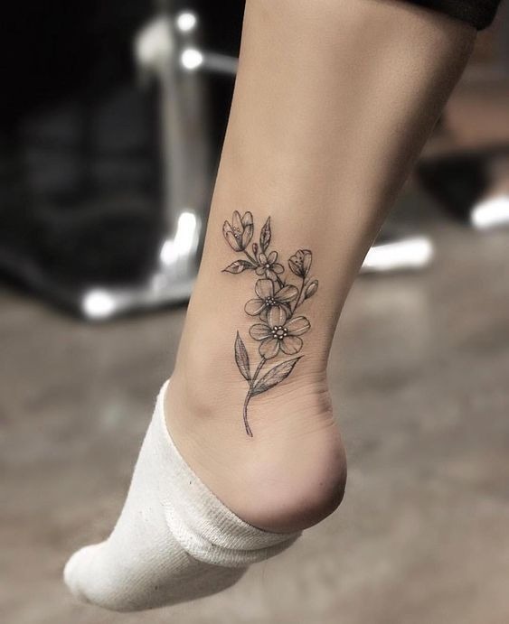 Minimalist Floral Curve Tattoo Design