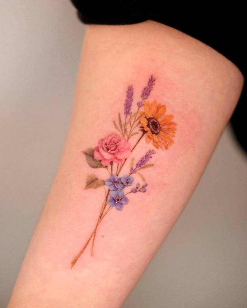 Delicate Birth Flowers Bouquet With a Soft, Romantic Mix, a tattoo design rendered in clean detailed linework.