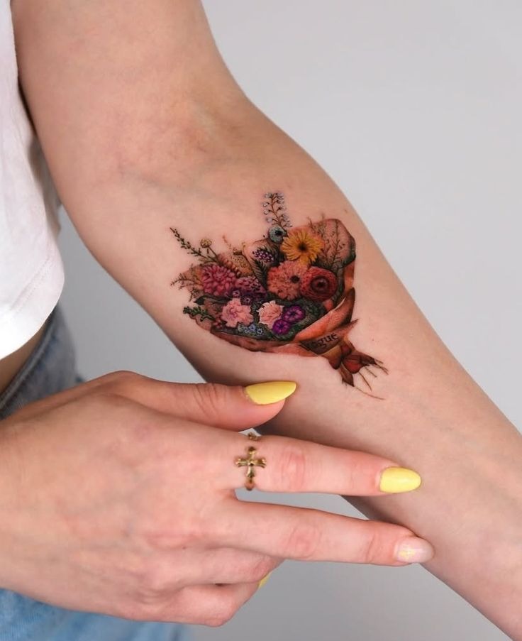 Mini Wrapped Bouquet With a Vintage Ribbon Feel, a tattoo design rendered in clean detailed linework.