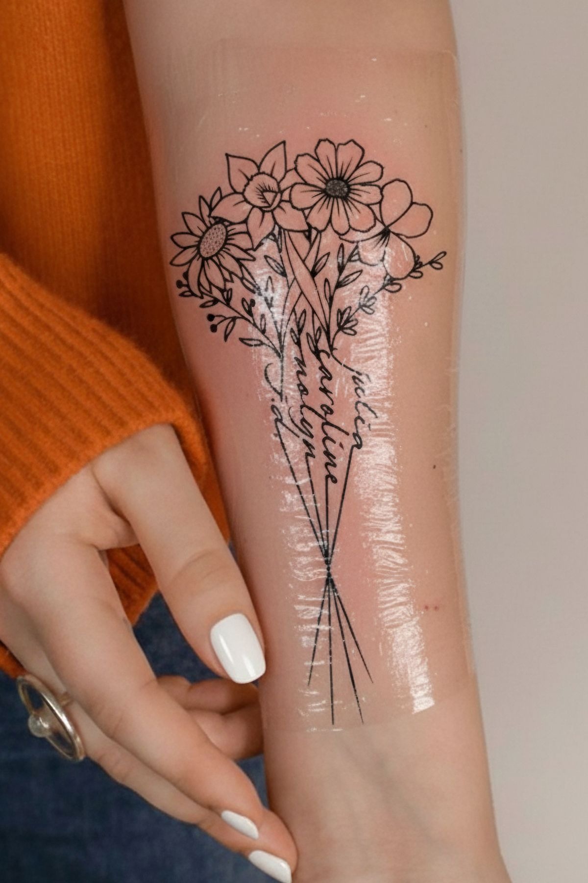 Minimalist Name-Stem Bouquet With Clean Linework, a tattoo design rendered in clean detailed linework for the rib.
