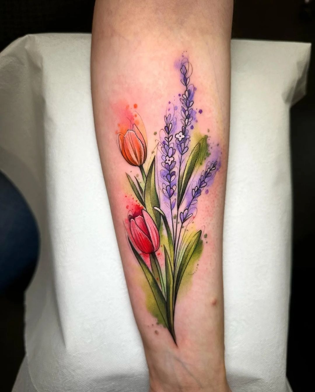 Tulip-and-Lavender Bouquet With Watercolor Glow, a tattoo design rendered in clean detailed linework for the leg.
