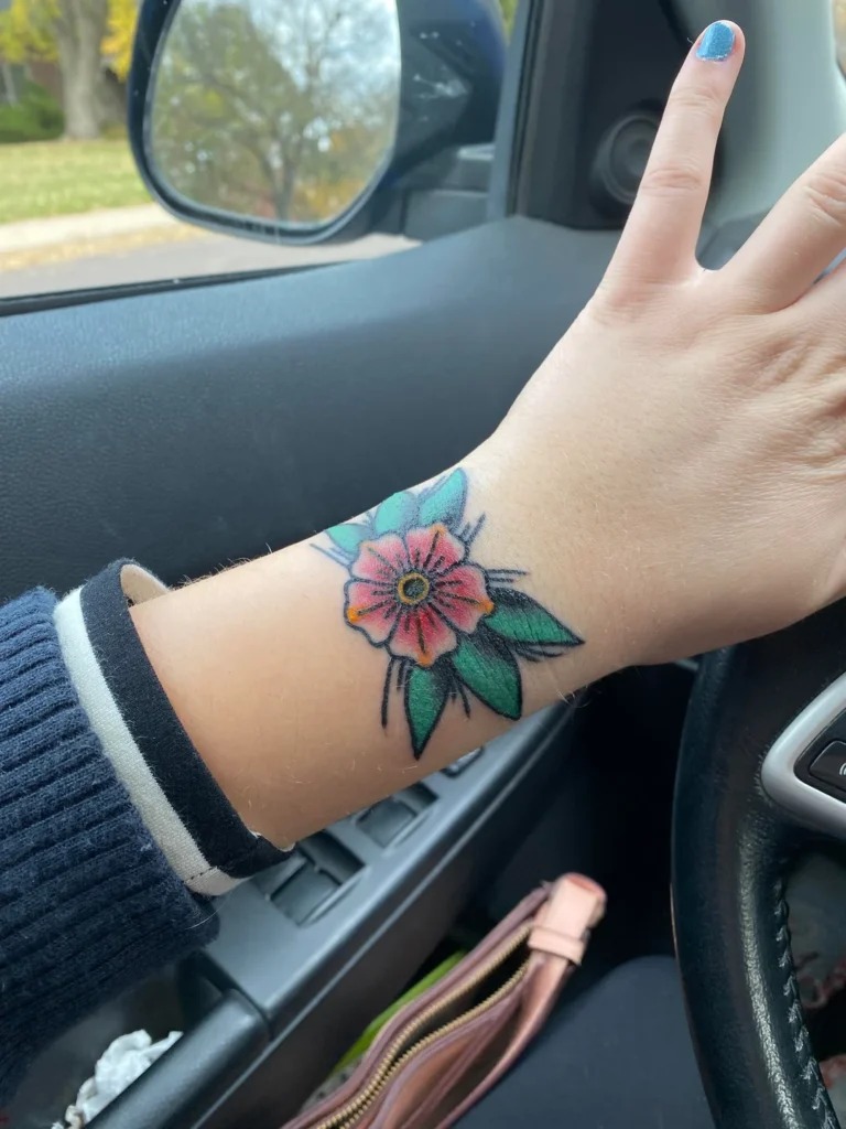 Bold Traditional Flower Wrist Tattoo Tattoo Design