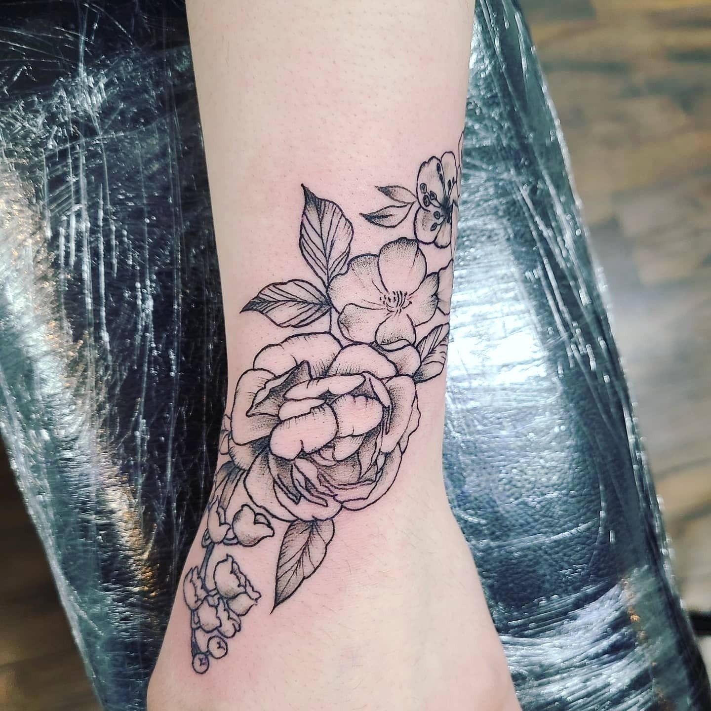 Elegant Black and Grey Floral Wrist Tattoo Tattoo Design