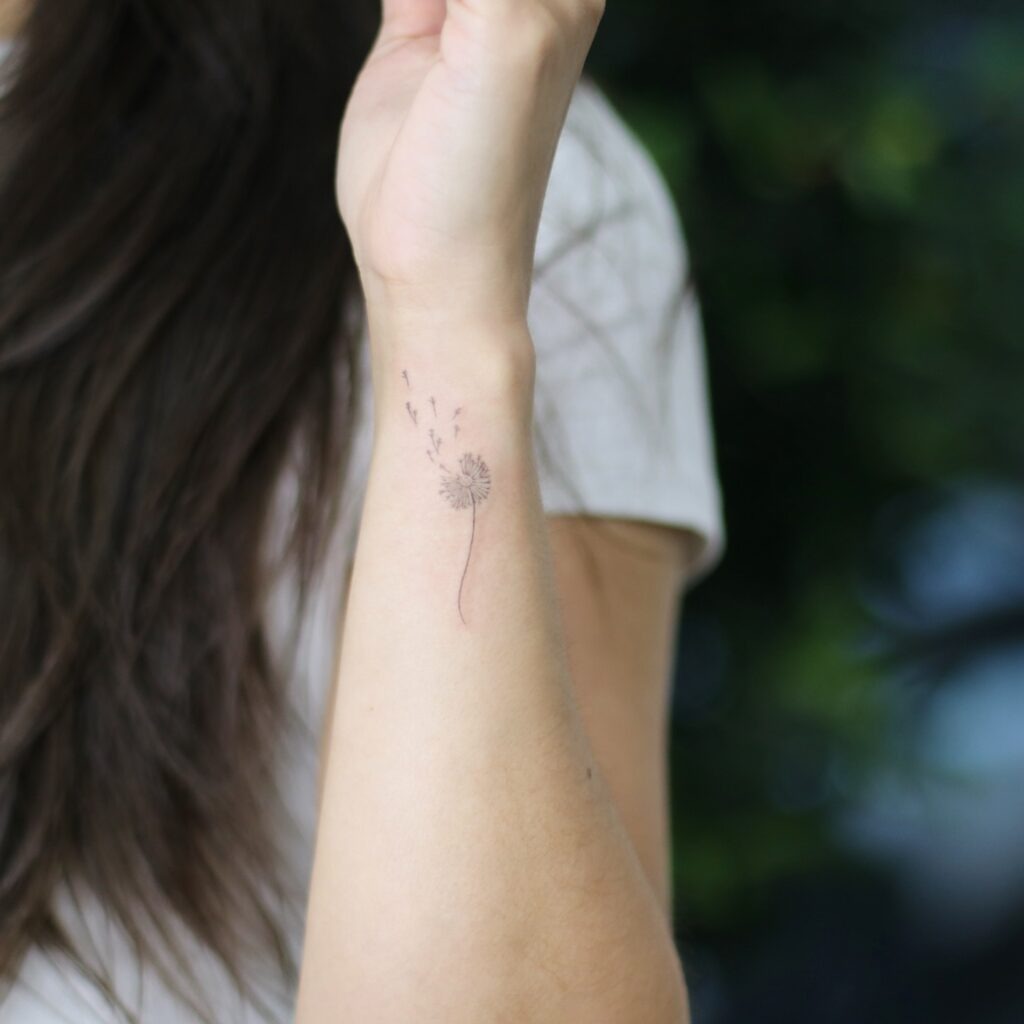 Seashell and Four-Leaf Clover Wrist Tattoo Tattoo Design