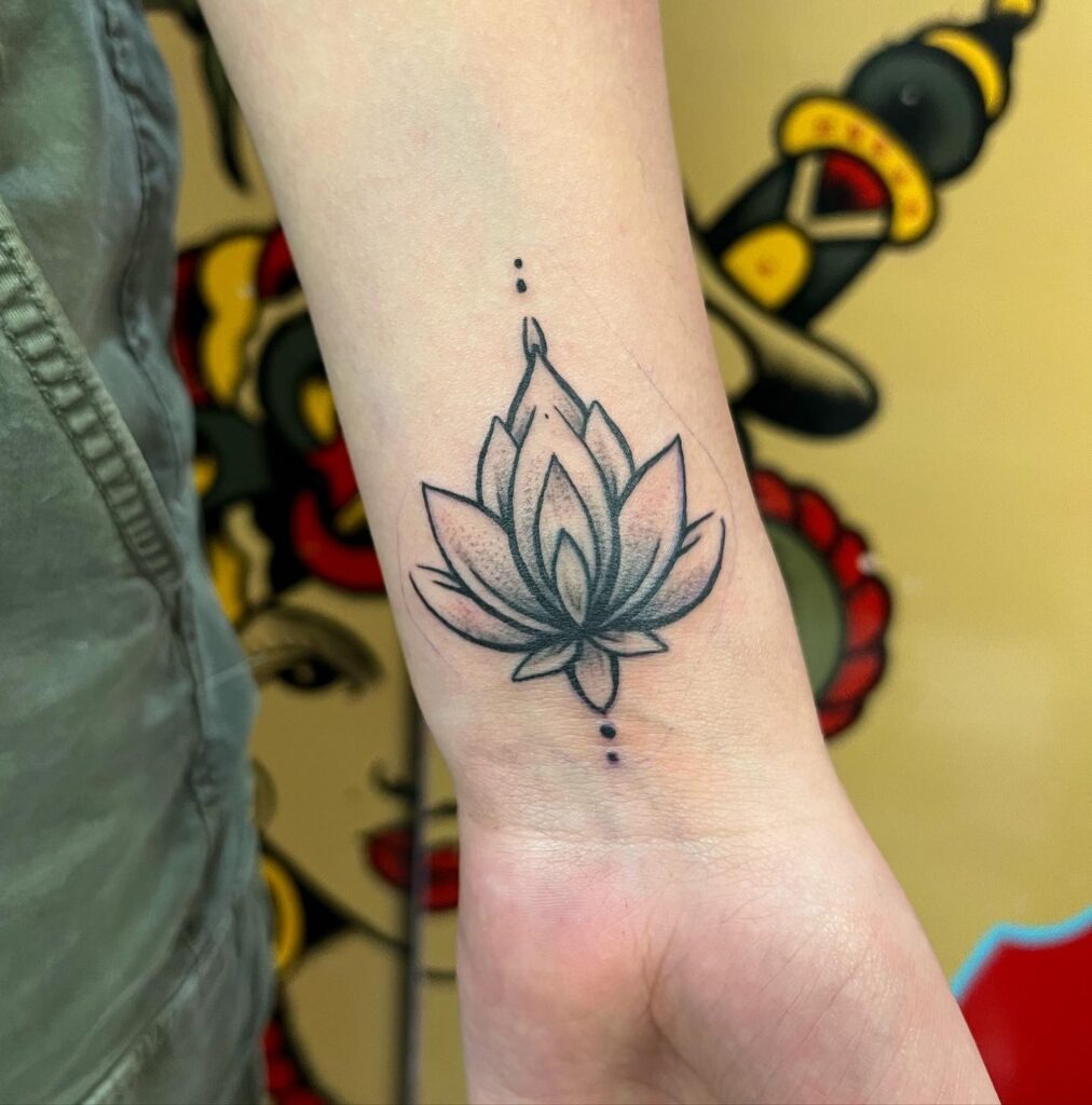 Shaded Lotus Wrist Tattoo with Dot Accents Tattoo Design