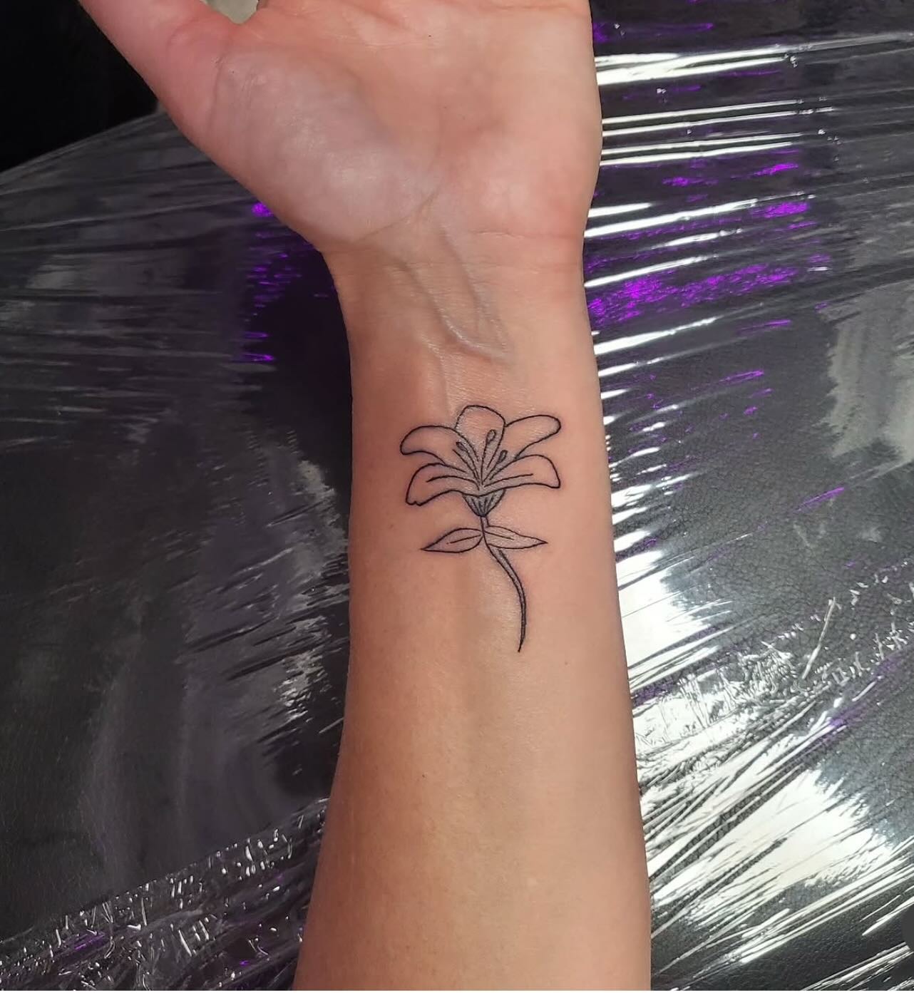 Simple Lily Linework Wrist Tattoo Tattoo Design