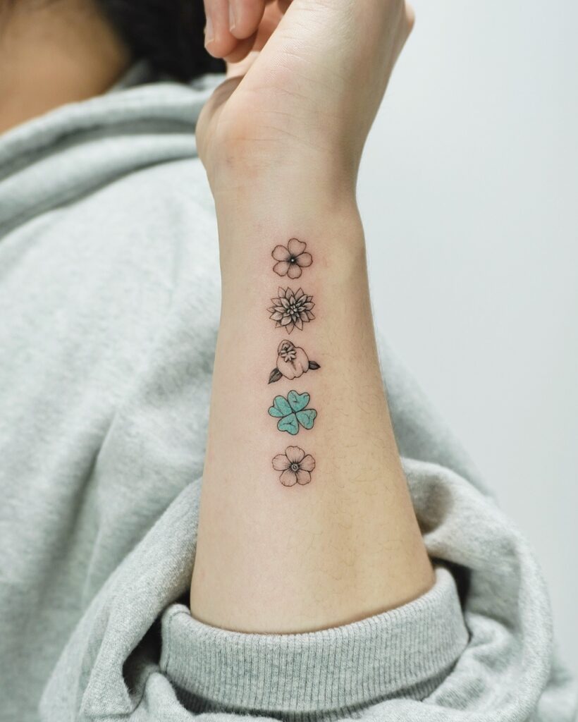 Stacked Floral Symbols Tattoo Tattoo Design