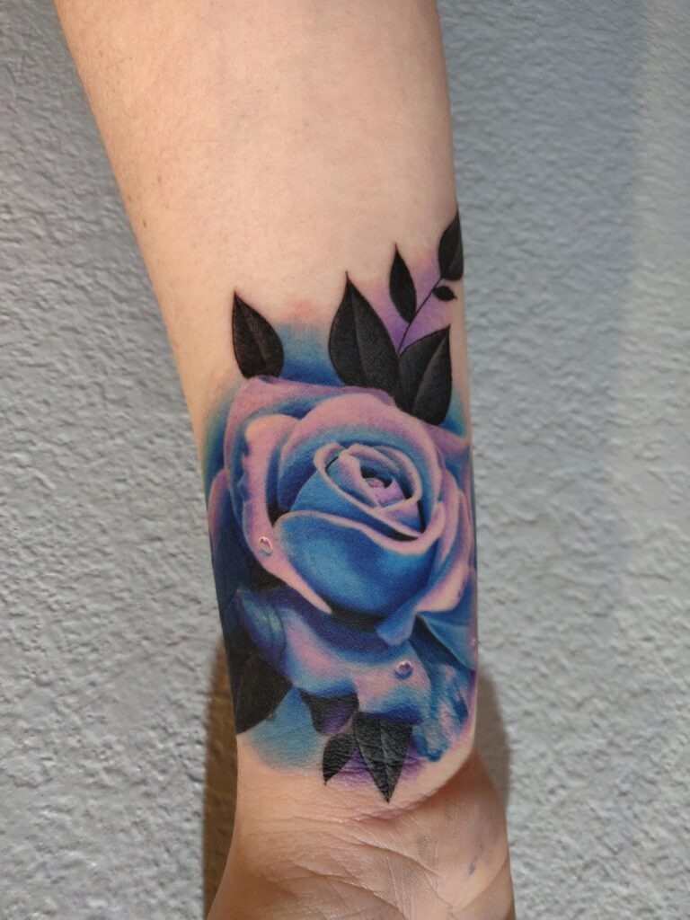 Vibrant Blue Rose Wrist Tattoo Tattoo Design
