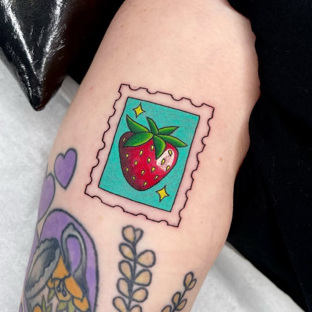 Charming strawberry stamp tattoo design Tattoo Design