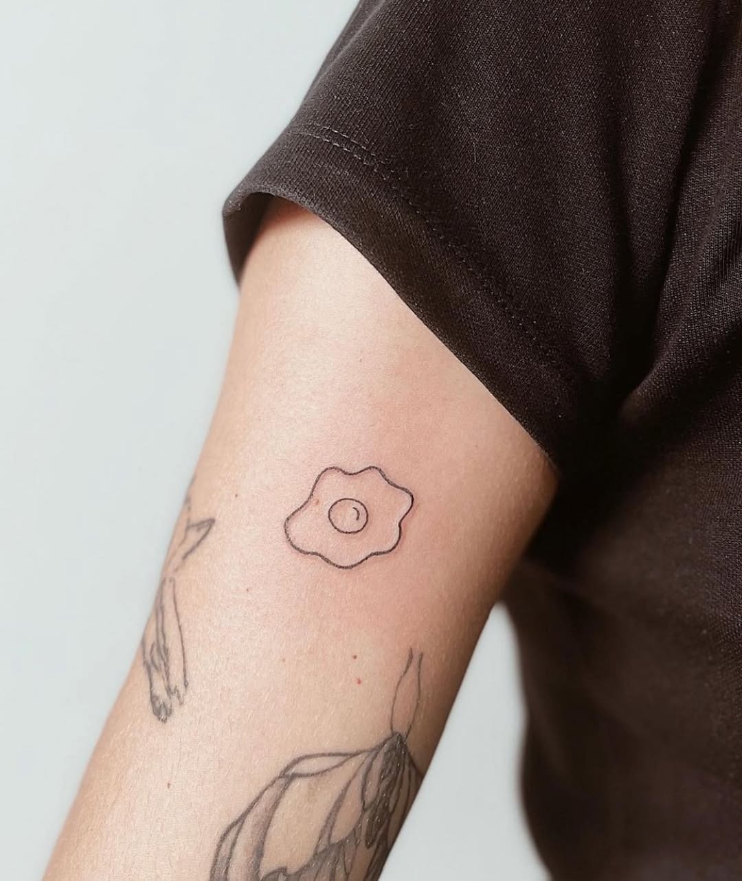 Minimalist fried egg tattoo design inspiration Tattoo Design