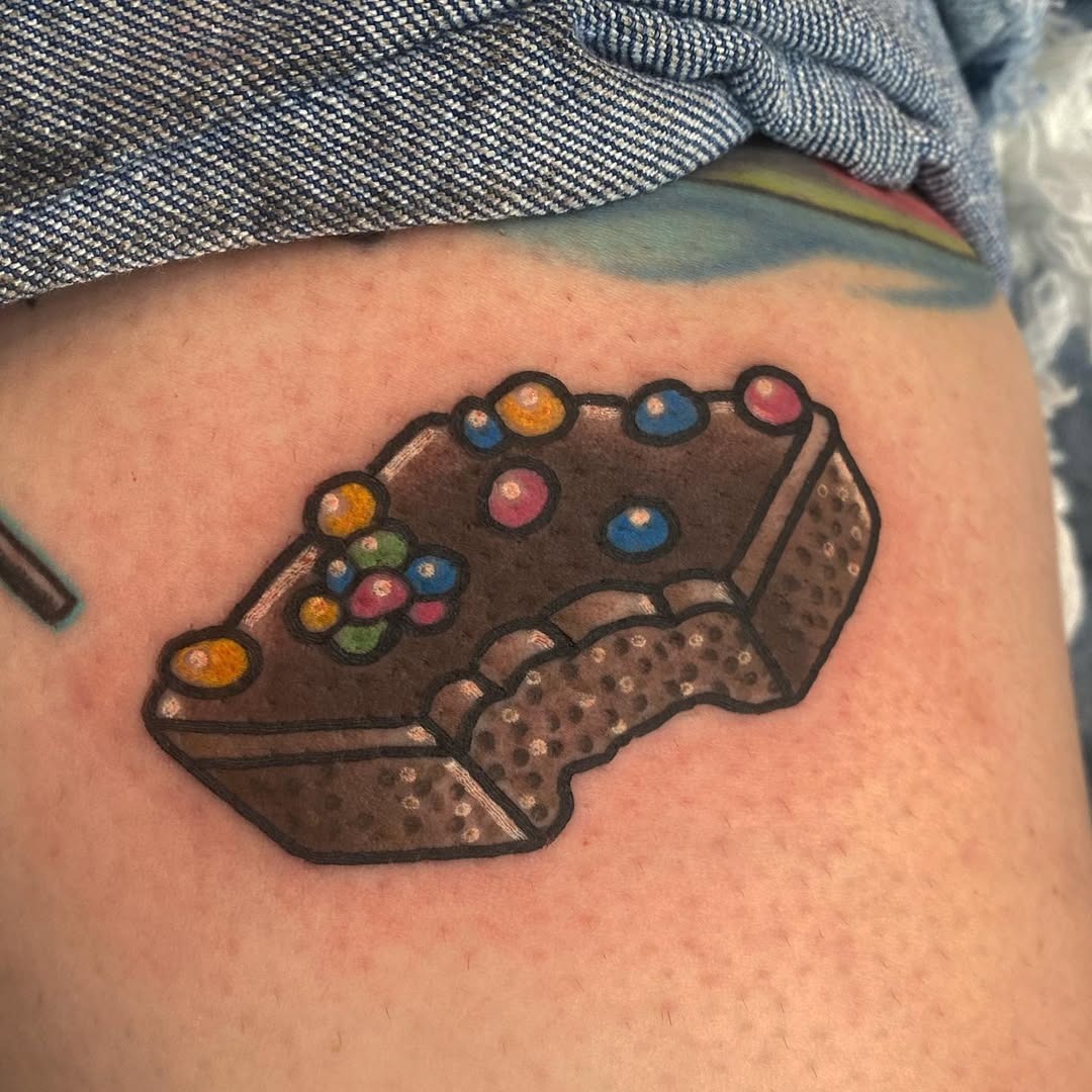Whimsical pastry tattoo with colorful toppings Tattoo Design