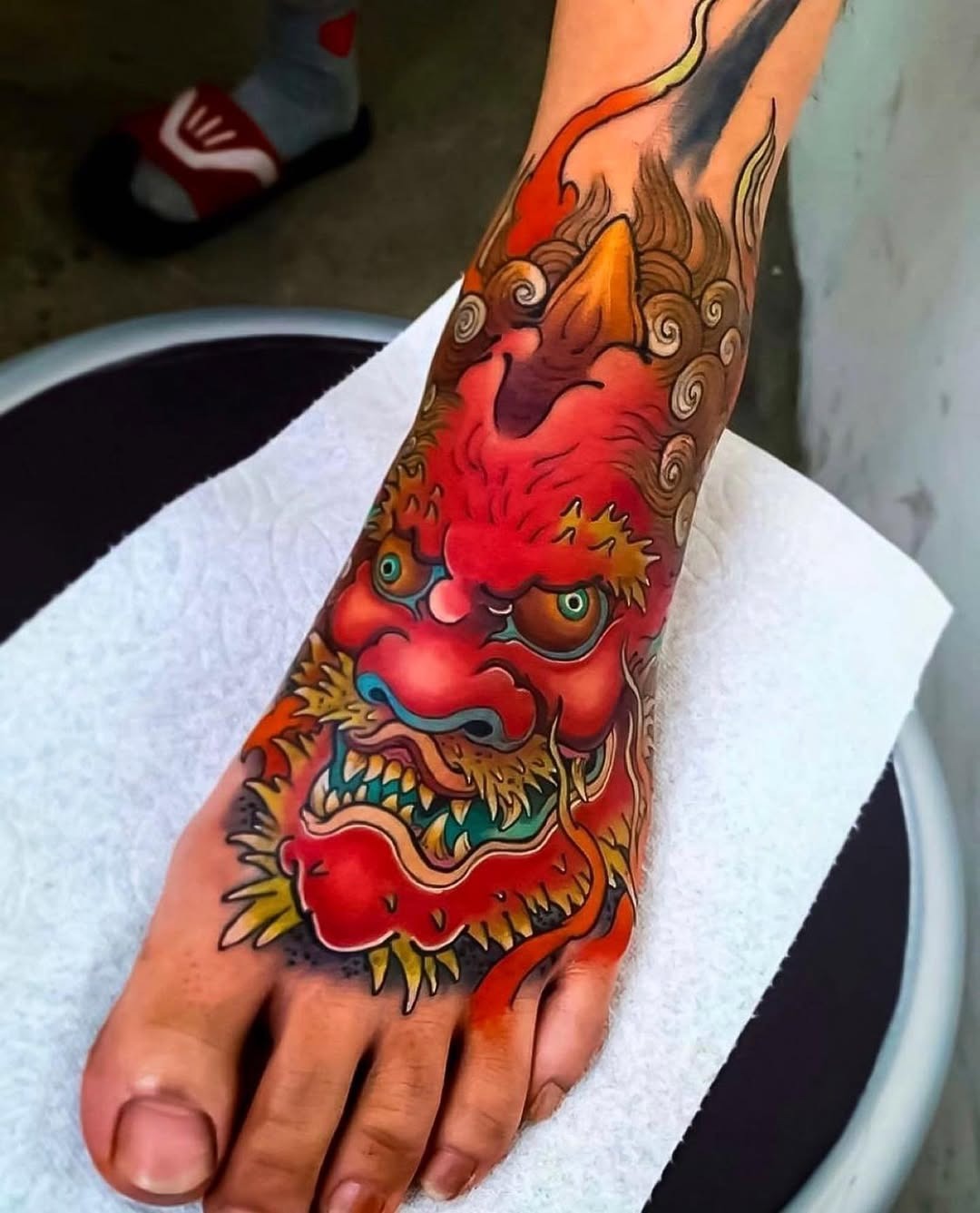 Bold dragon tattoo igniting foot artistry Tattoo Design