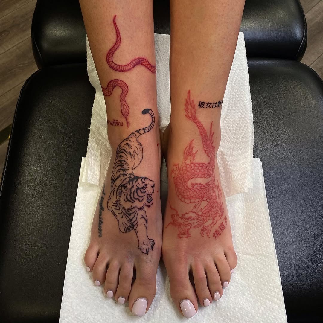 Bold foot tattoos featuring fierce animals Tattoo Design