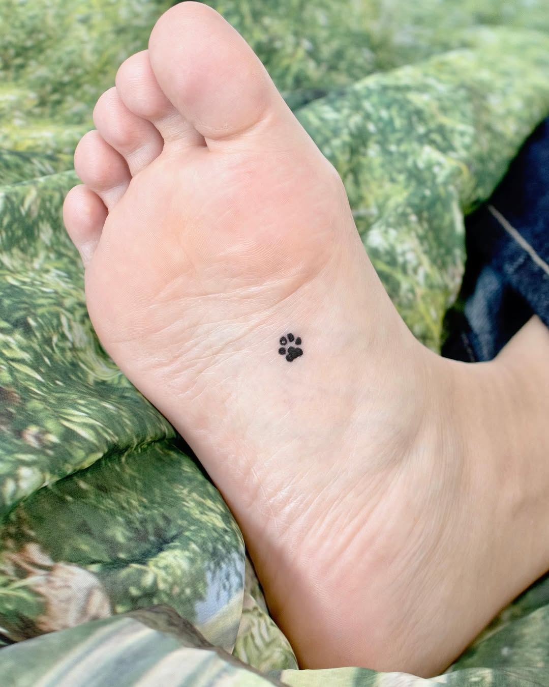 Charming small paw print foot tattoo Tattoo Design