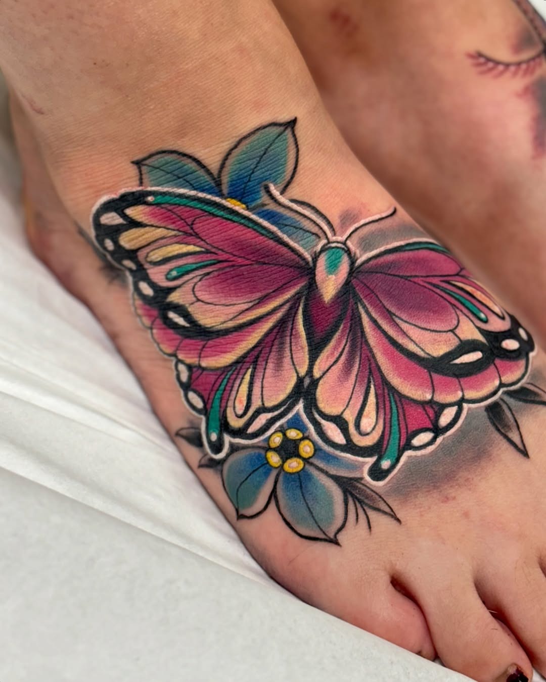 Colorful butterfly tattoo on foot Tattoo Design