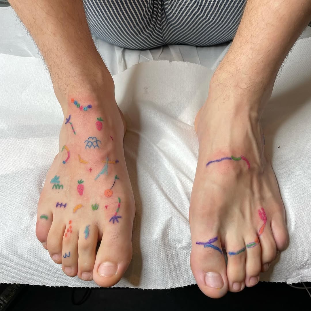 Colorful, playful foot tattoos with artistic flares Tattoo Design