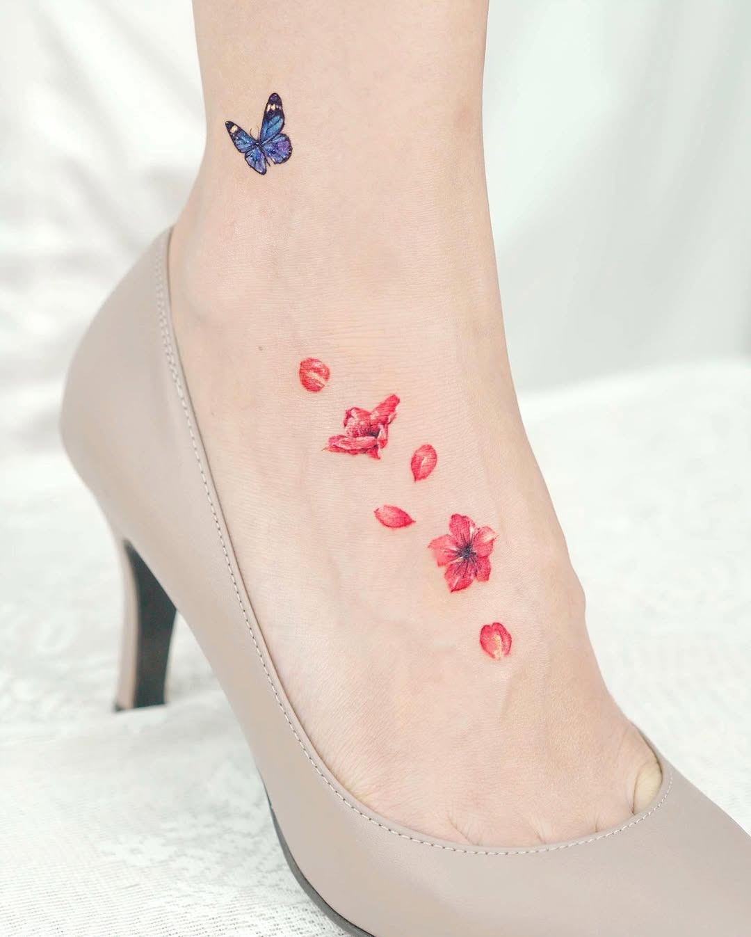 Delicate butterfly and floral foot tattoo design Tattoo Design