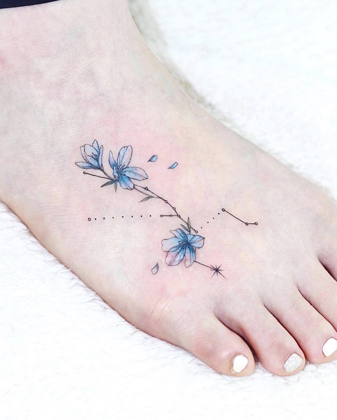 Delicate floral tattoo with constellation detail Tattoo Design