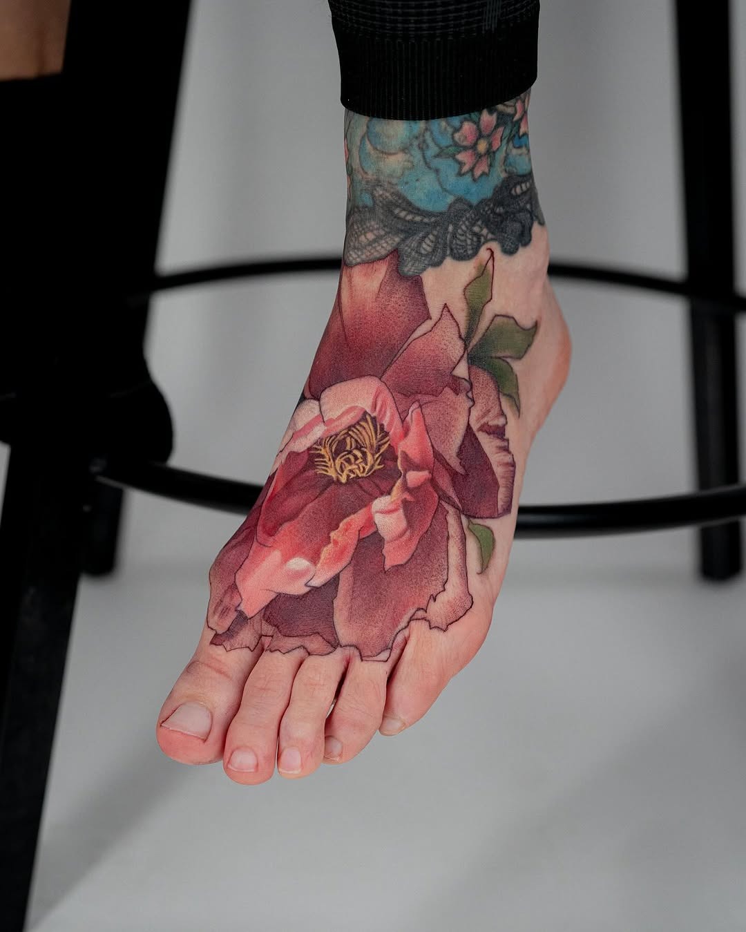 Elegant floral foot tattoo showcasing beauty and artistry Tattoo Design