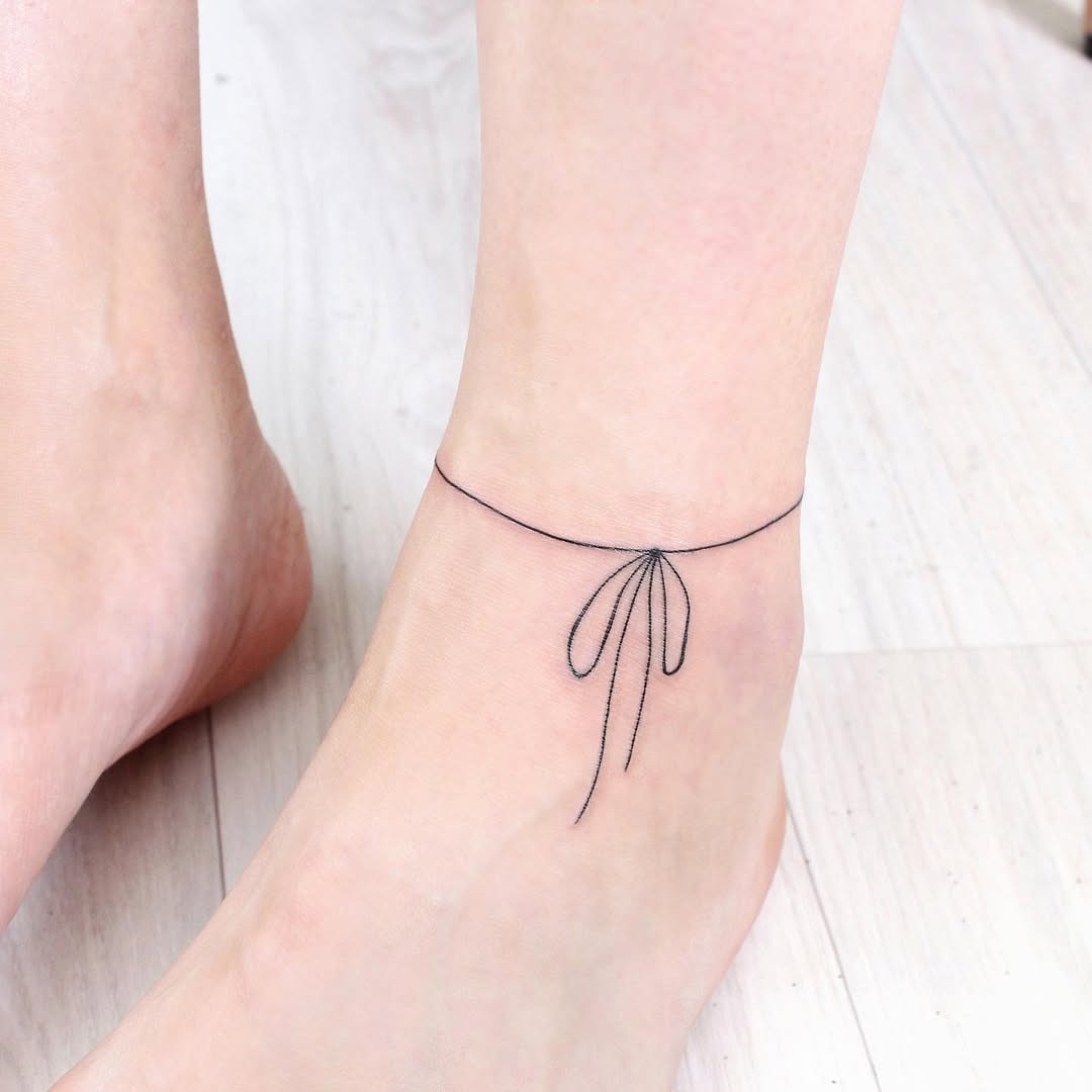 Elegant minimalist foot tattoo for a delicate look Tattoo Design