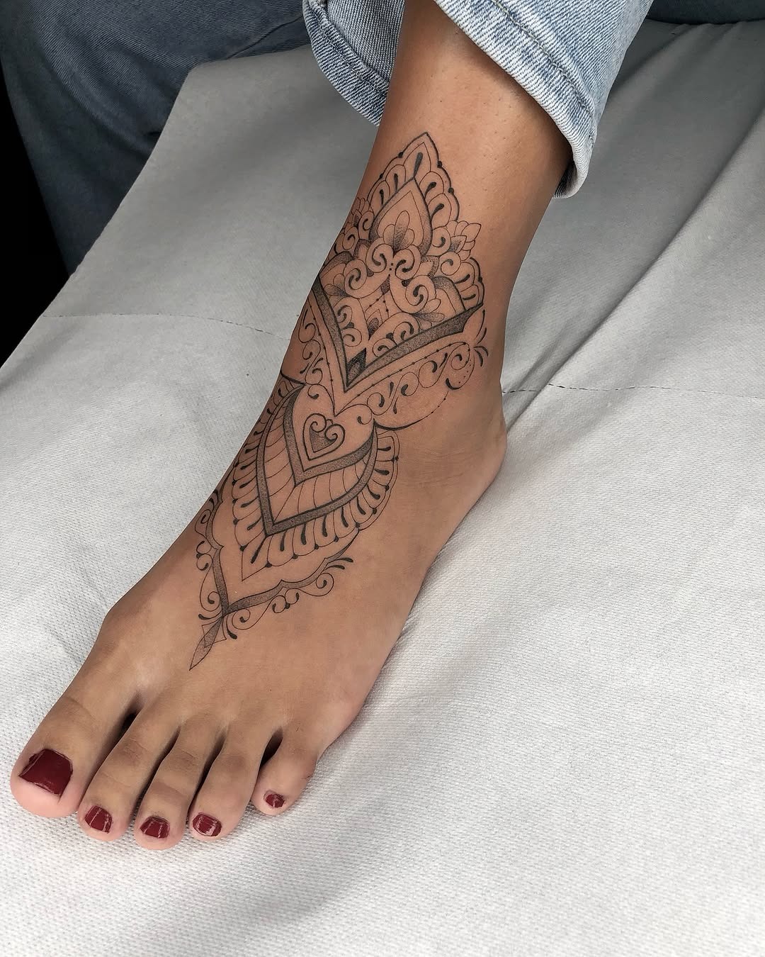 Intricate geometric foot tattoo design on display Tattoo Design