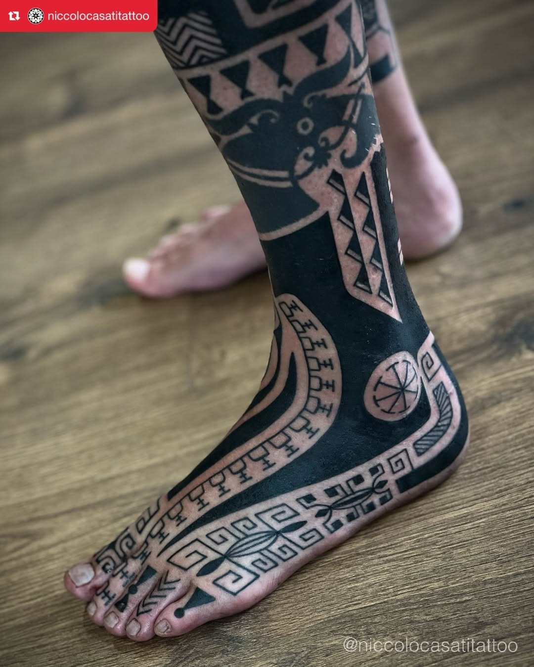 Stunning black and white tribal foot tattoo Tattoo Design