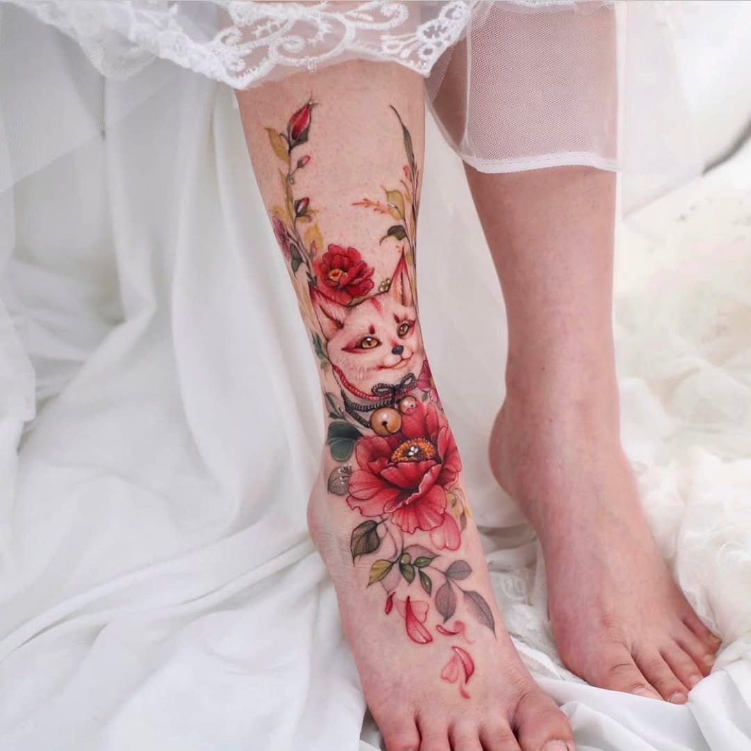 Vibrant Floral Cat Tattoo on Foot Tattoo Design