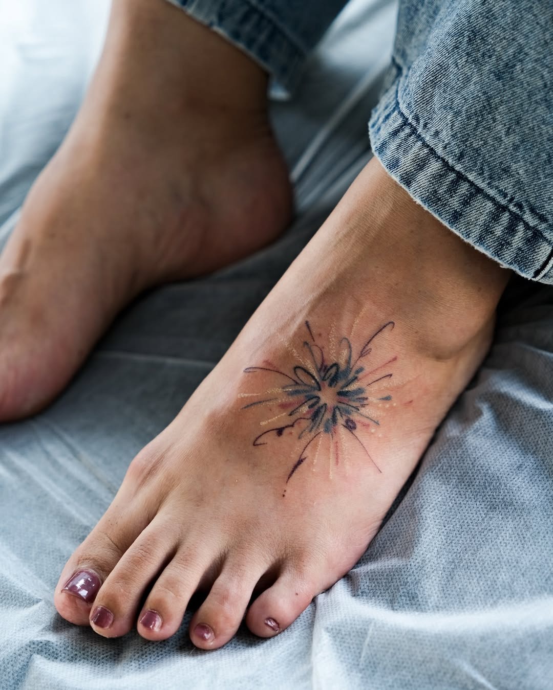 Vibrant floral design on the foot Tattoo Design