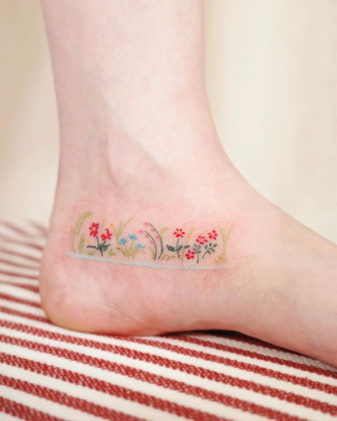 Vibrant Floral Foot Tattoo Design for Nature Lovers Tattoo Design