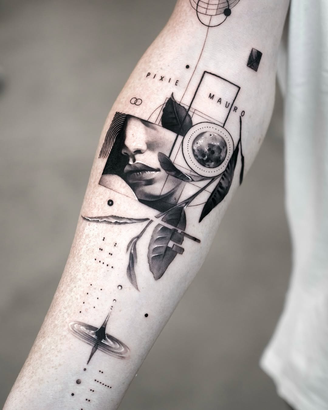 This forearm tattoo blends modern blackwork with delicate details, showing a woman's face surrounded by geometric shapes and nature-inspired elements.
