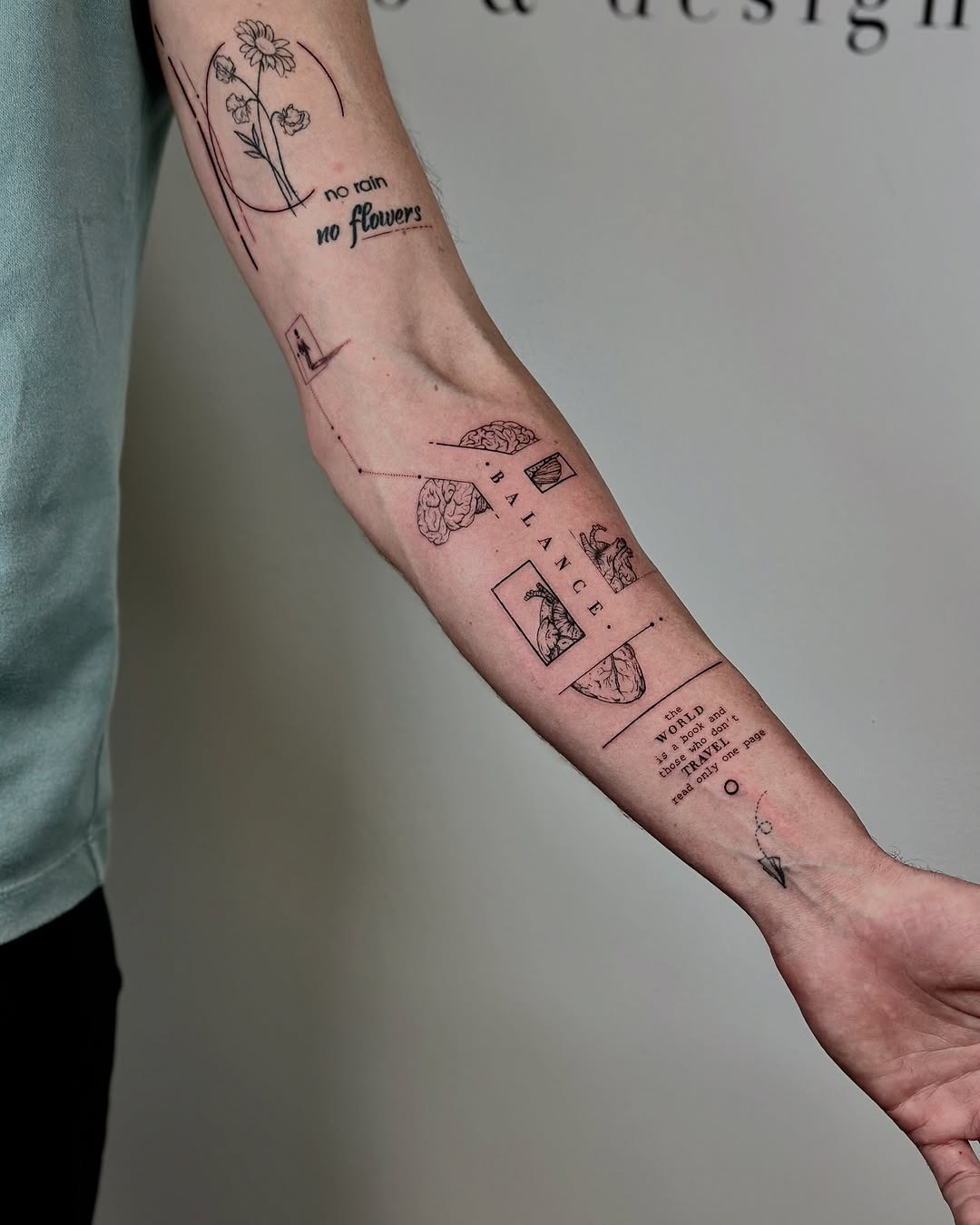 This forearm tattoo combines delicate floral elements with geometric shapes, creating a balanced aesthetic.