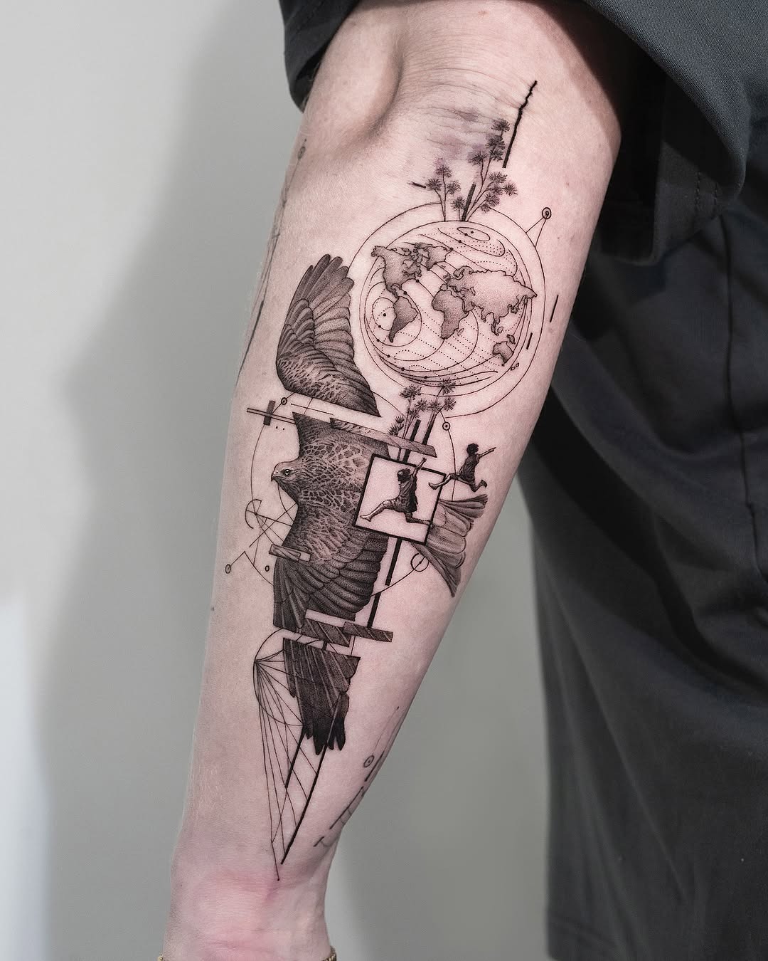 This forearm tattoo features a stunning combination of birds, geometric shapes, and nature elements.