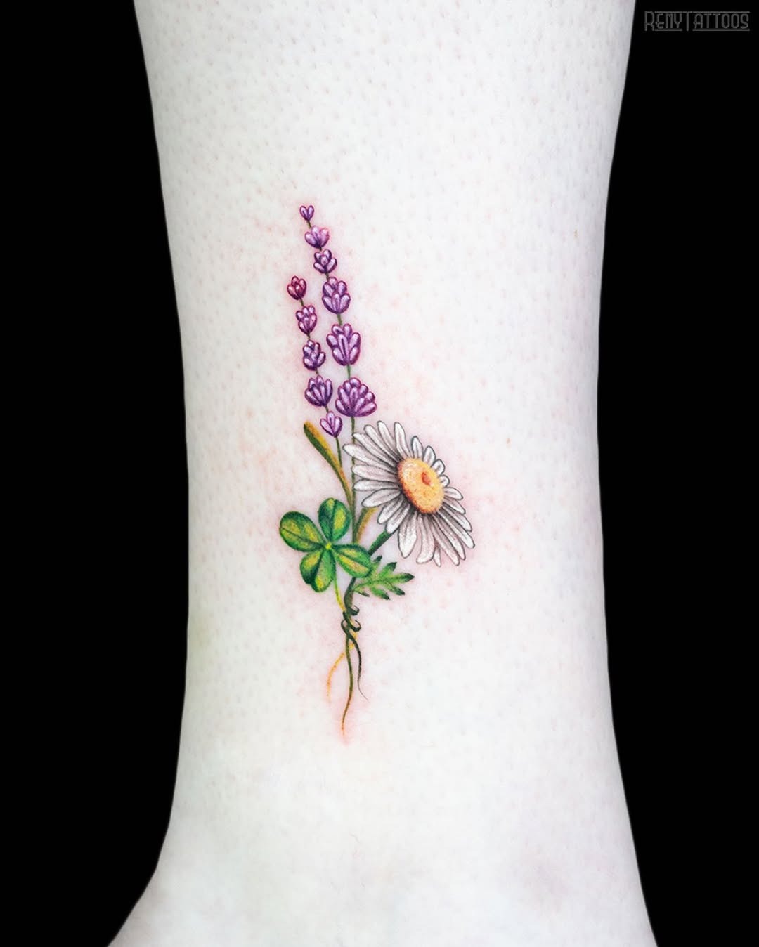 Charming four leaf clover and flower tattoo. Tattoo Design