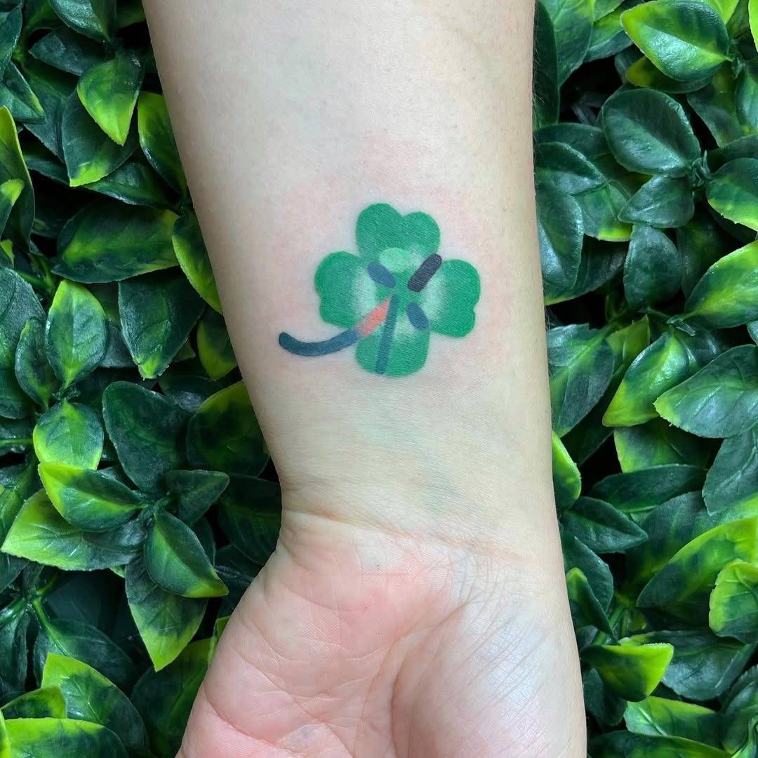 Charming green four leaf clover tattoo design Tattoo Design