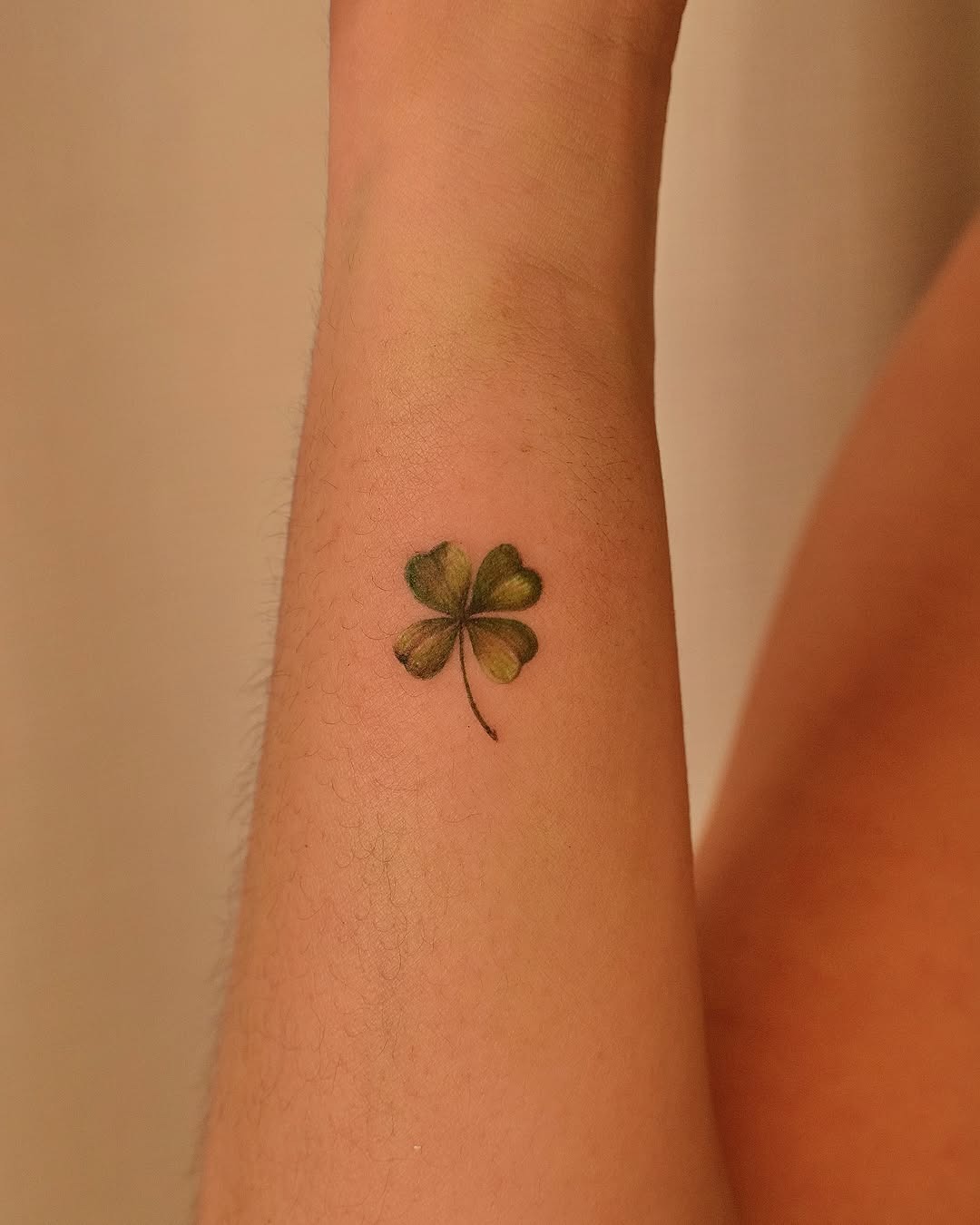 Elegant four leaf clover tattoo on the arm Tattoo Design