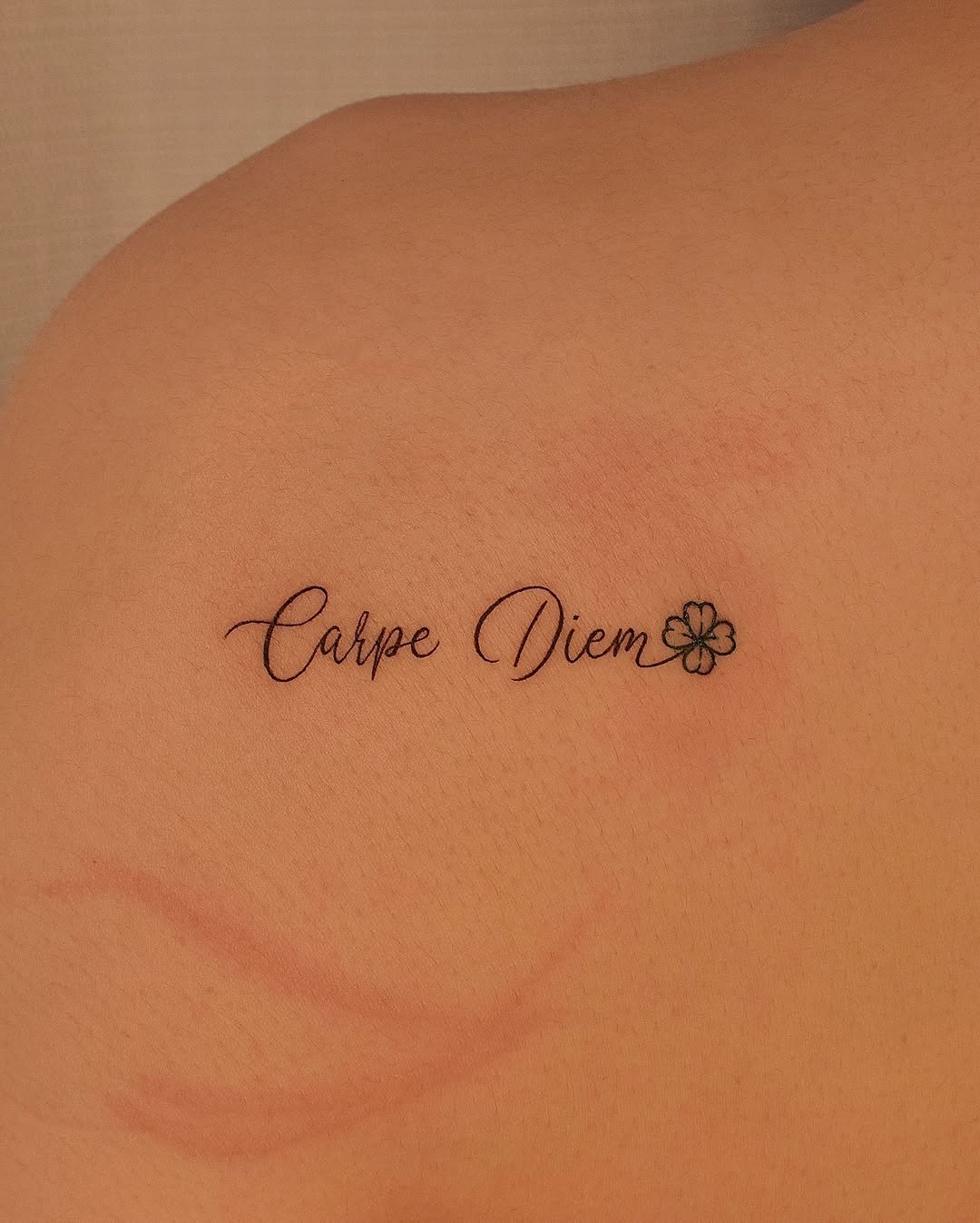 Elegant four leaf clover tattoo with phrase Tattoo Design