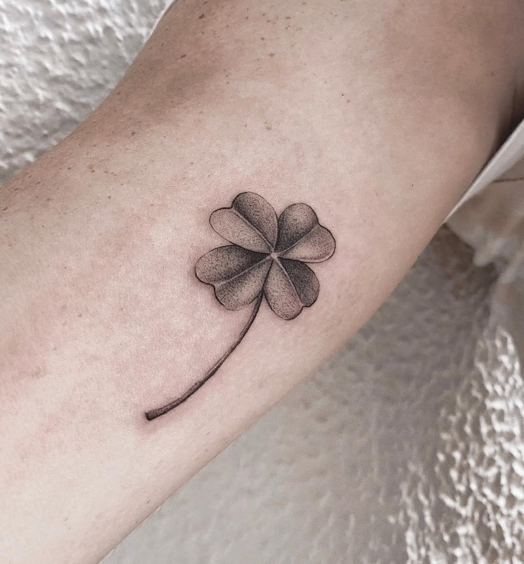 Elegant four leaf clover tattoo with soft shading Tattoo Design