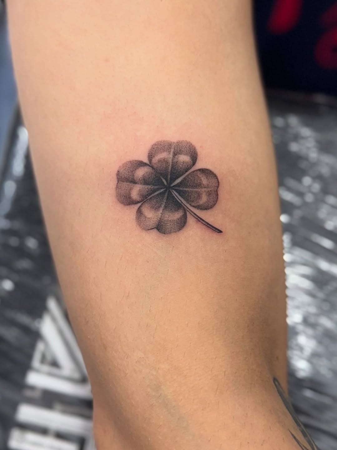 Realistic four leaf clover tattoo in black ink Tattoo Design