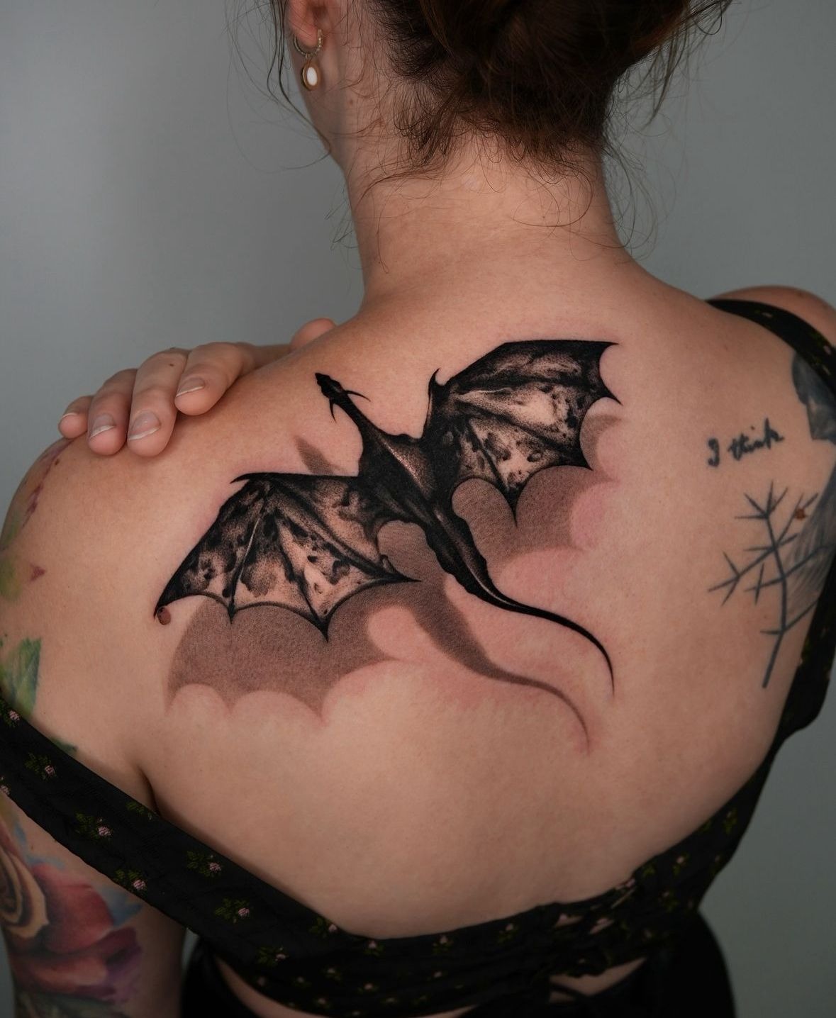 Bold Shoulder Blade Dragon in Deep Black Ink Tattoo Design