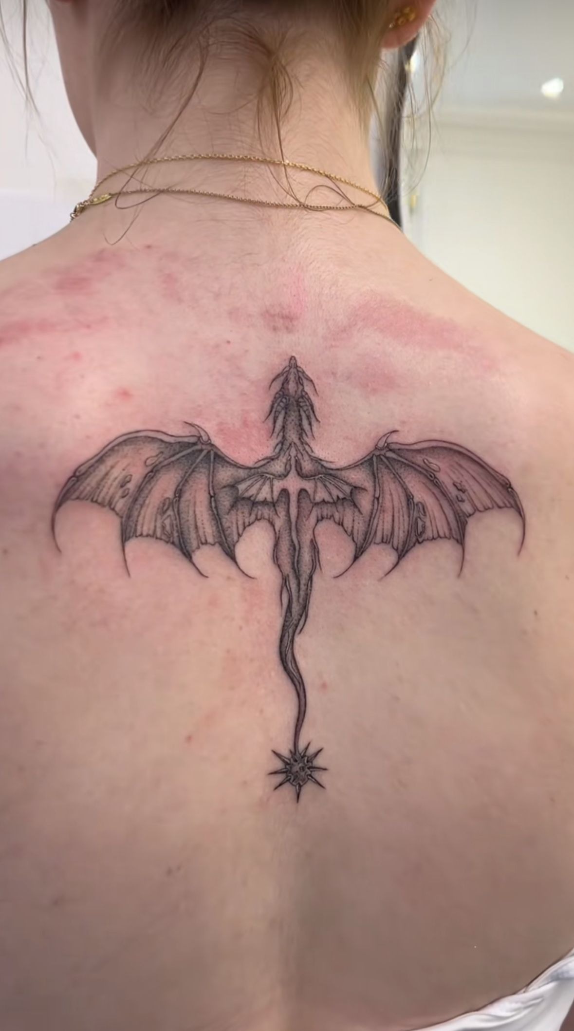 Fine-Line Spine Dragon with Soft Wing Detail Tattoo Design