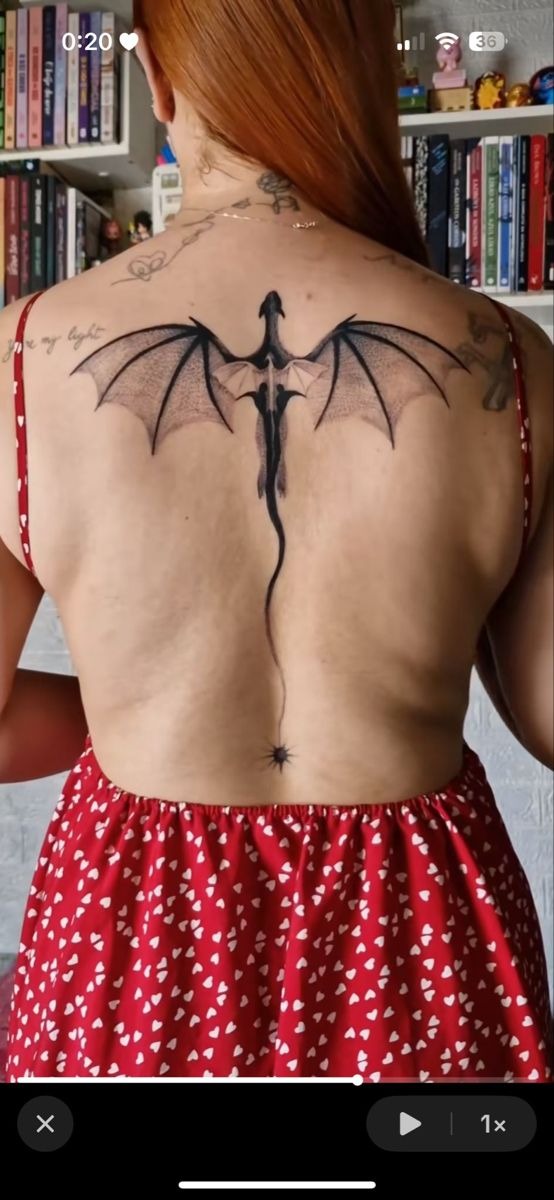Minimal Black Dragon Across the Upper Back Tattoo Design