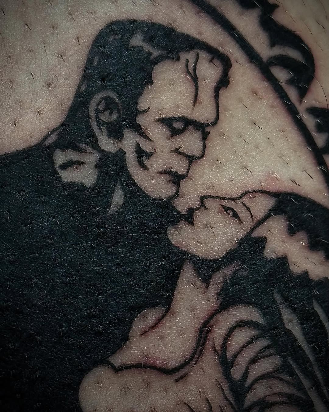 Iconic embrace of Frankenstein and his bride Tattoo Design