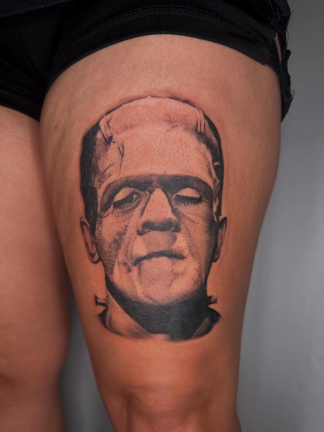 Iconic Frankenstein tattoo in bold black and gray Tattoo Design