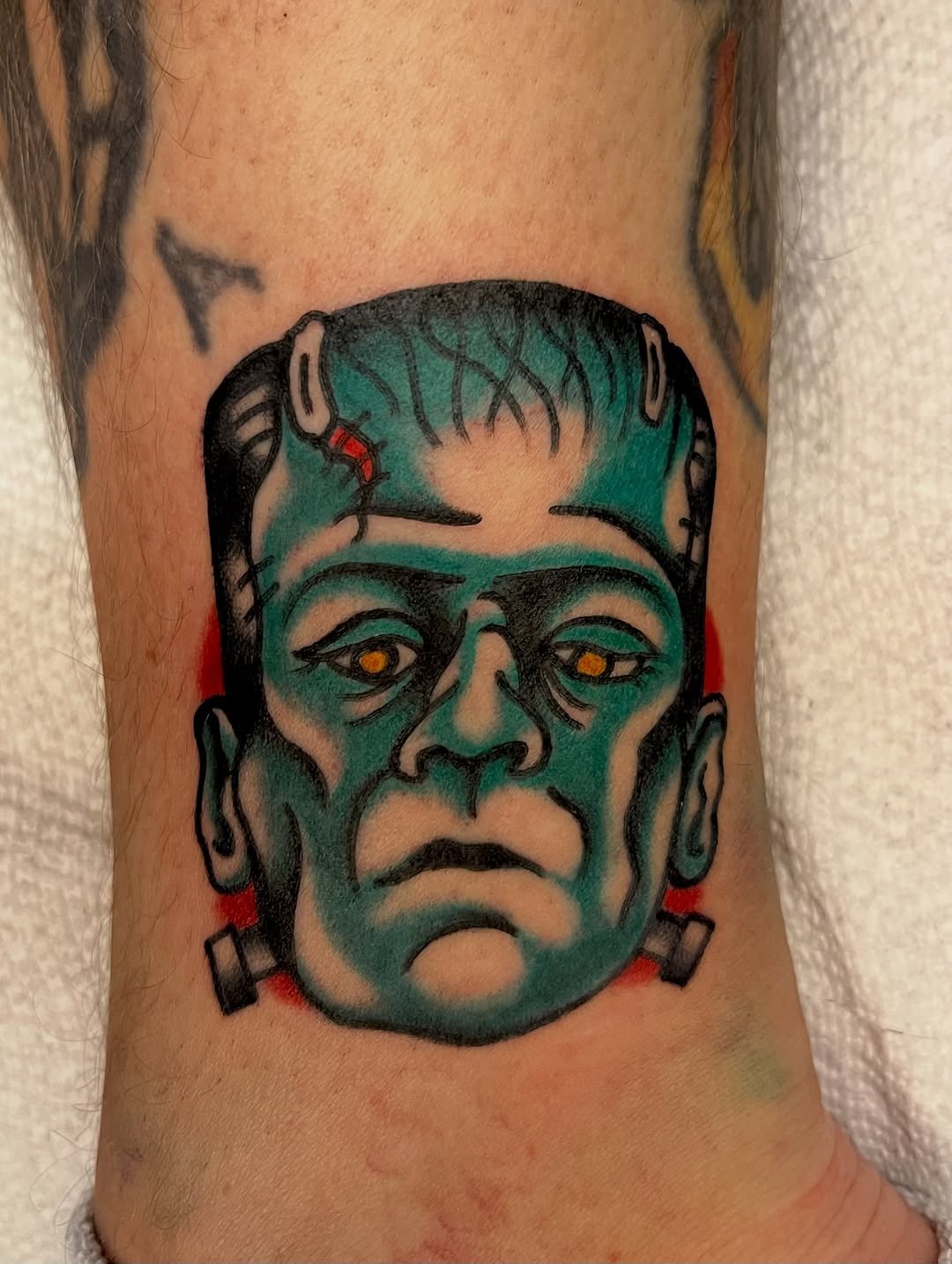 Striking Frankenstein Tattoo with Bold Colors Tattoo Design