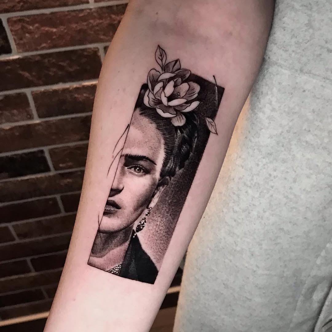 Striking Frida Kahlo Portrait with Floral Element Tattoo Design