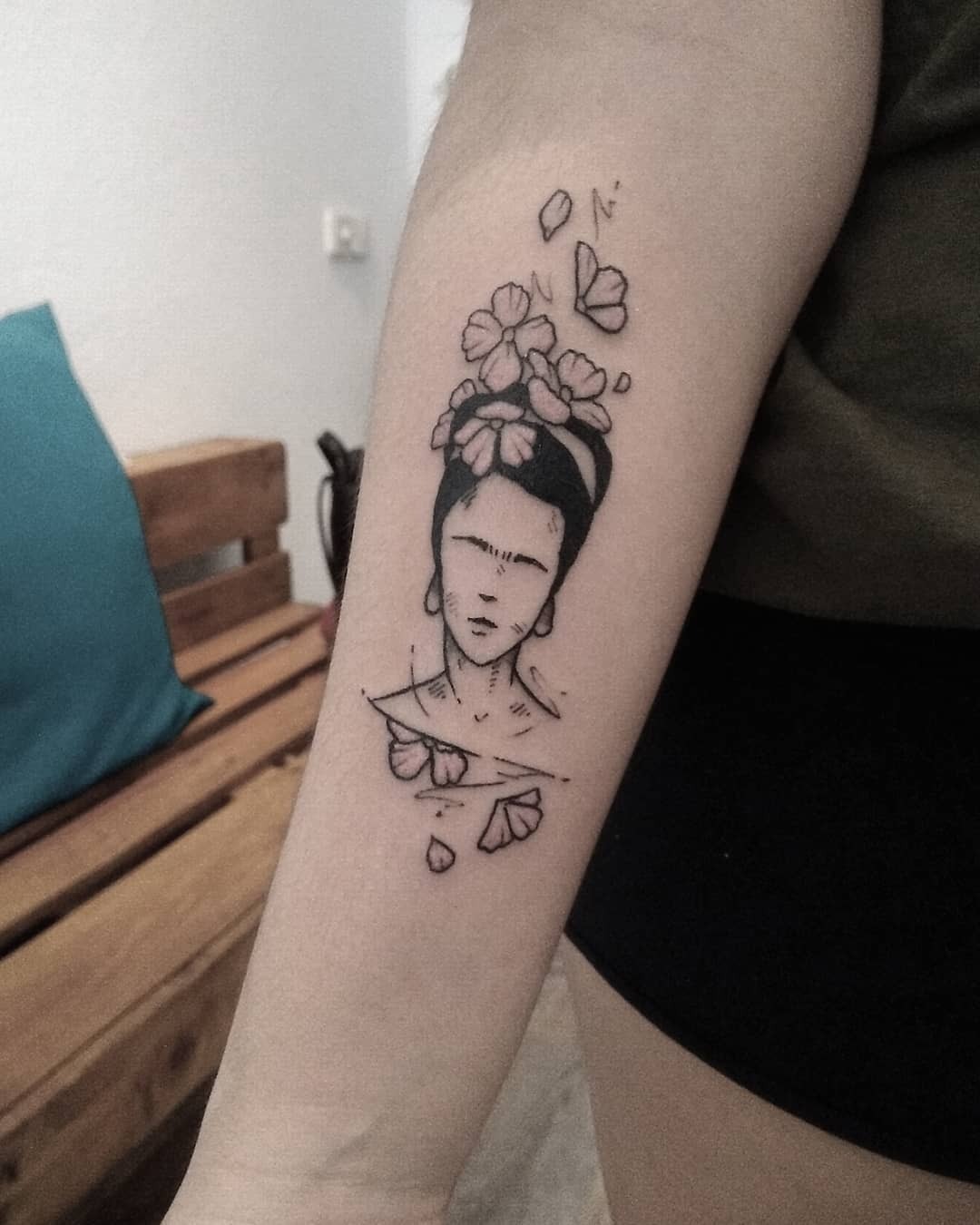 Stunning Frida Kahlo Tattoo with Floral Elements Tattoo Design