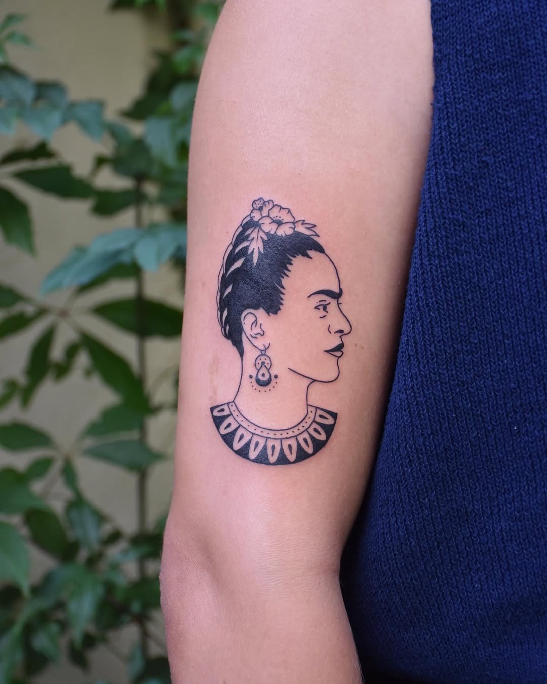 Vibrant Frida Kahlo Tattoo with Floral Accents Tattoo Design