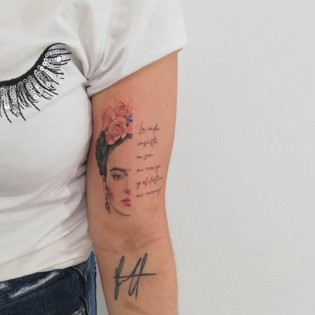 Whimsical Frida Kahlo Tattoo with Floral Accents Tattoo Design